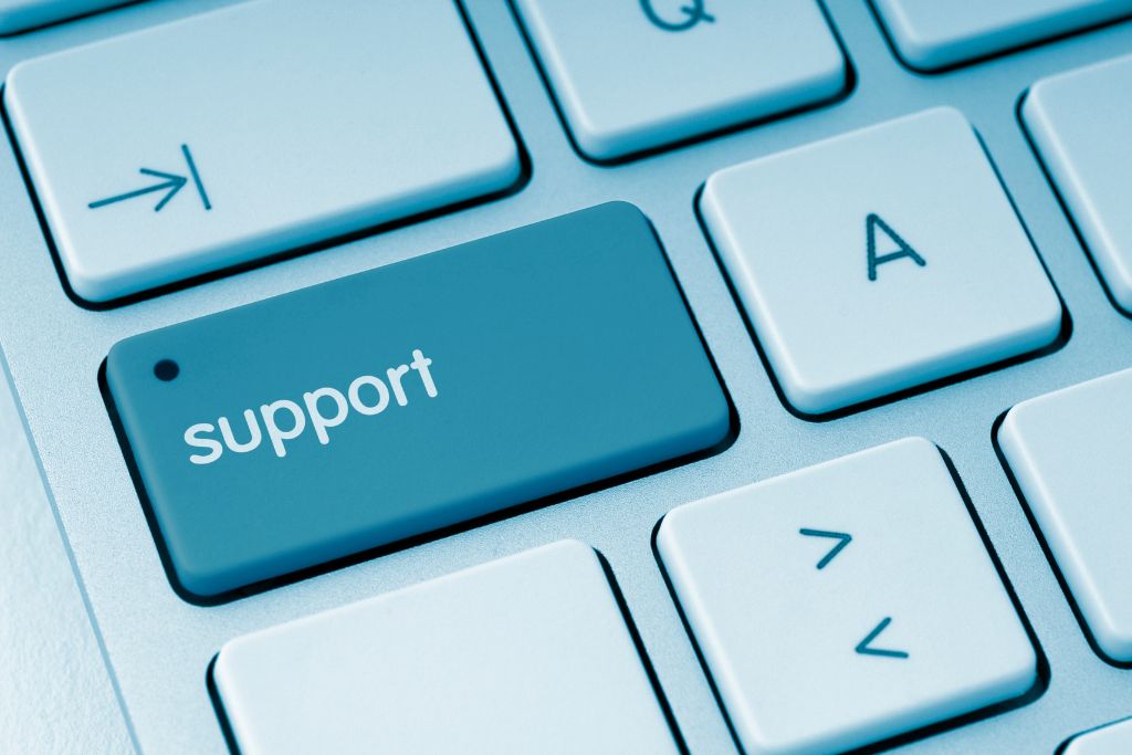 a key on a keyboard that reads "Support"