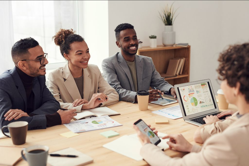 a group of people sitting around a conference table