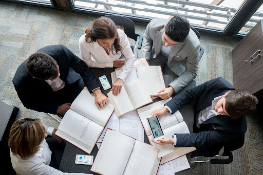 people working around table